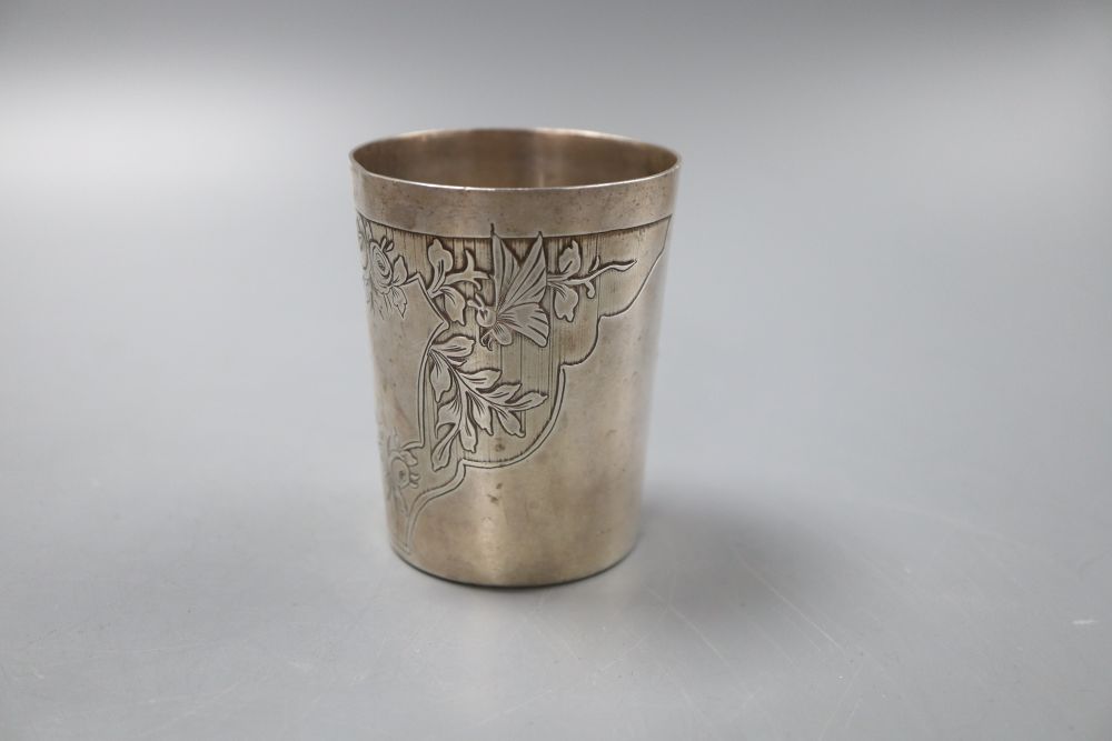 A French white metal tumbler cup, decorated with flowers and butterflies, 7.5cm